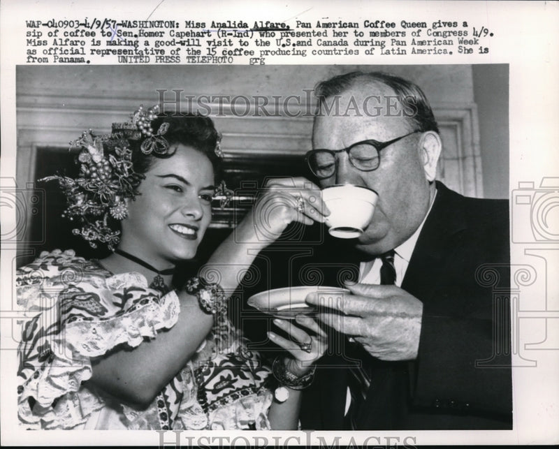 Load image into Gallery viewer, 1957 Press Photo Analida Alfare of Panama Gives Coffee to Sen. Homer Capehart
