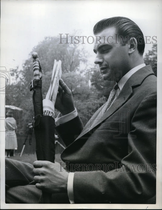 1958 Press Photo Man Displays German Umbrella That Doubles as Briefcase