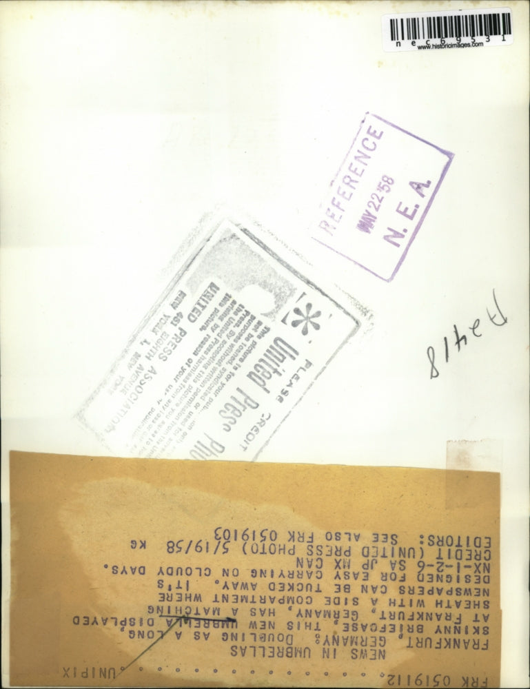 1958 Press Photo Man Displays German Umbrella That Doubles as Briefcase