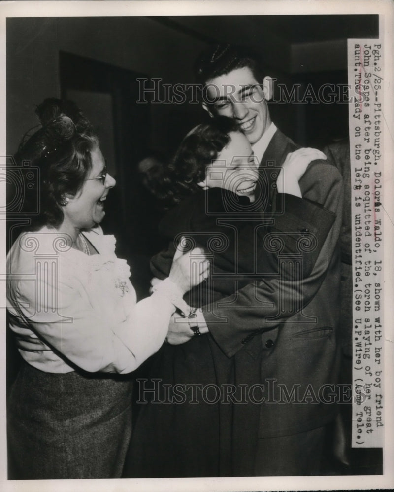 Load image into Gallery viewer, 1949 Press Photo Dolores Waldo Acquitted of Aunt Murder Charge Hugs Boyfriend
