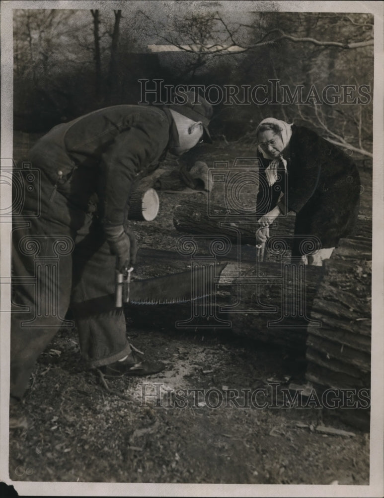 Load image into Gallery viewer, 1947 Press Photo Mr. and Mrs. George Stone Cutting Wood in Lumber Camp in Burton
