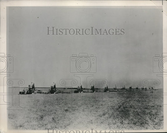 1940 Press Photo A wheat field as harvesters pass through it
