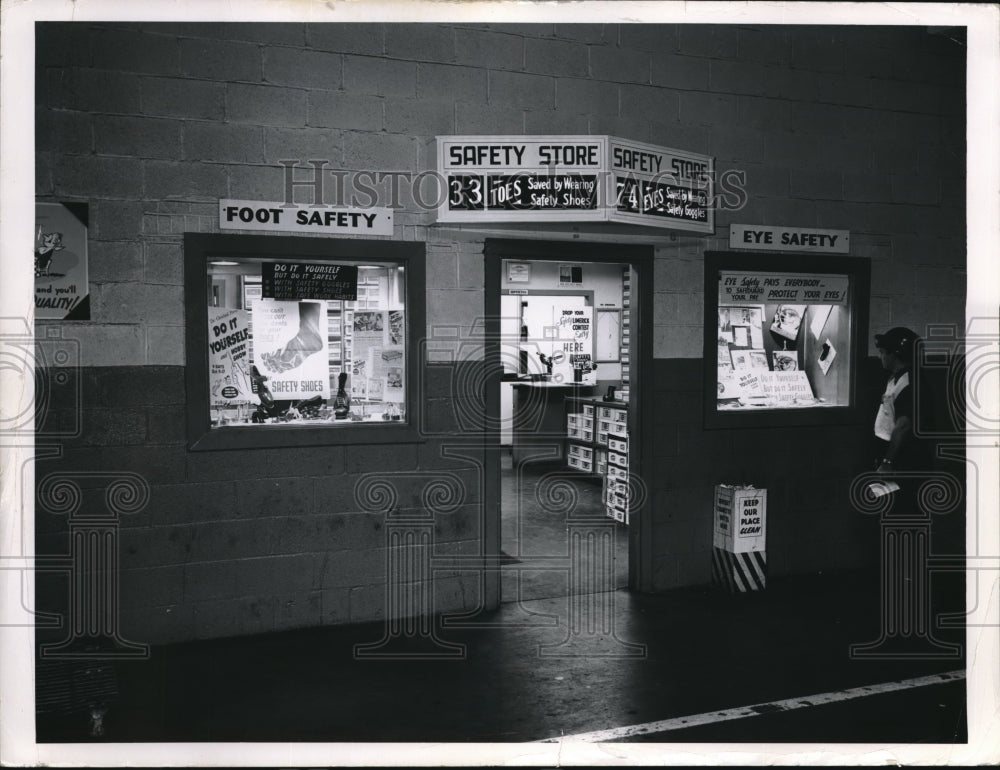1954 Press Photo Safety store front display with eye & foot protective gear
