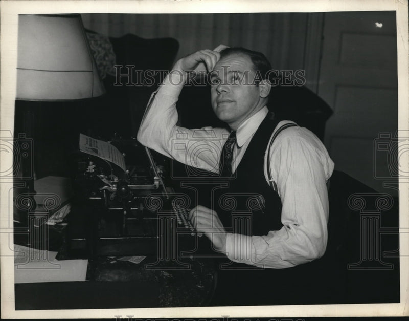 Load image into Gallery viewer, 1937 Press Photo Charley Winters at work in front of typewriter
