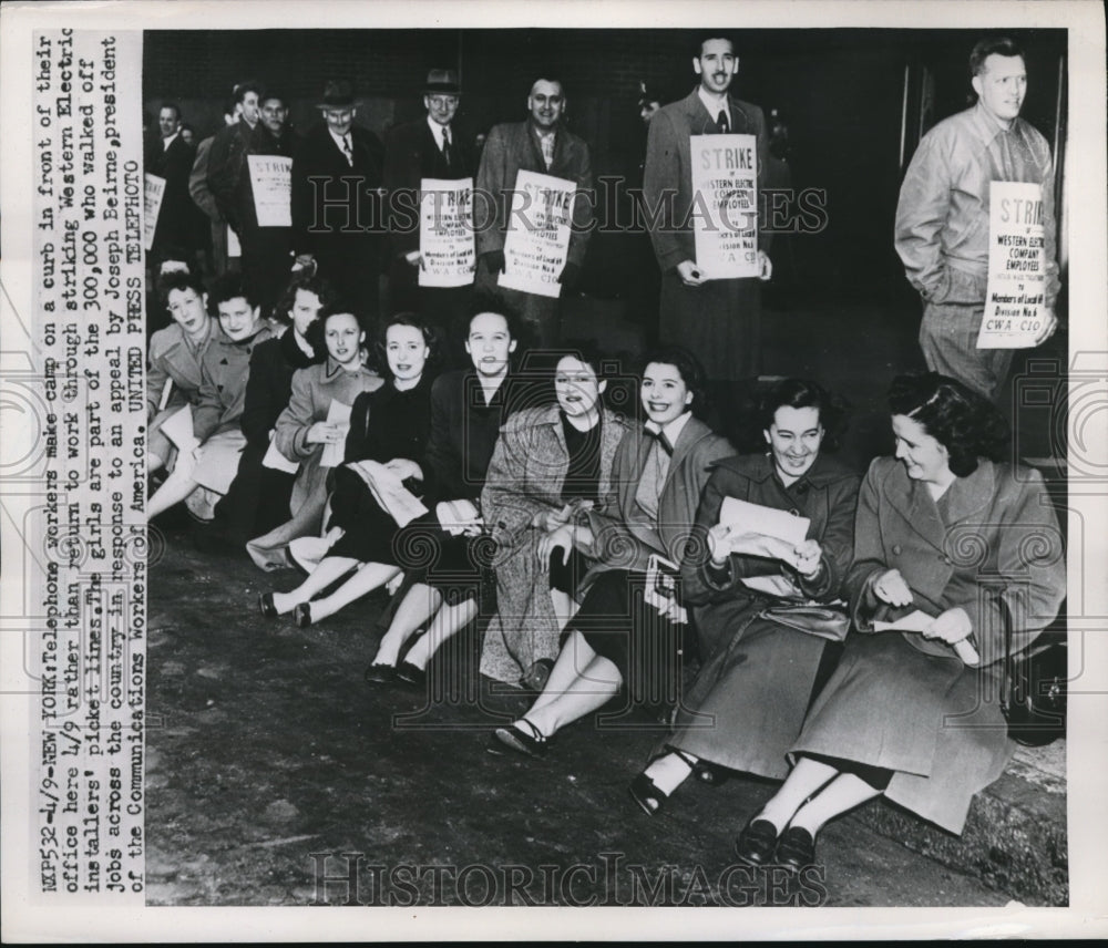 1952 Press Photo striking telephone co. workers sit on curb outside office in NY