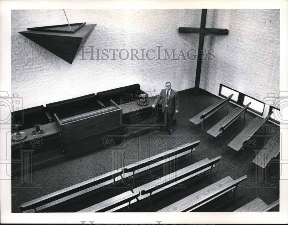 Press Photo A man stands inside a new church near the altar