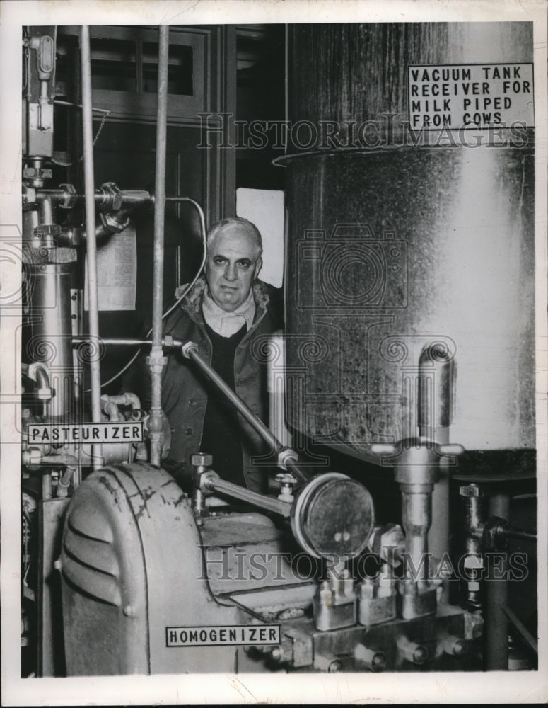 1949 Press Photo Dr. Roy Graves Inspects Machinery for Canning Fresh Milk