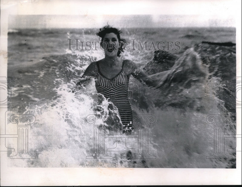 Load image into Gallery viewer, 1955 Press Photo Miami Beach, Fla Robin Sindel in the surf at the beach
