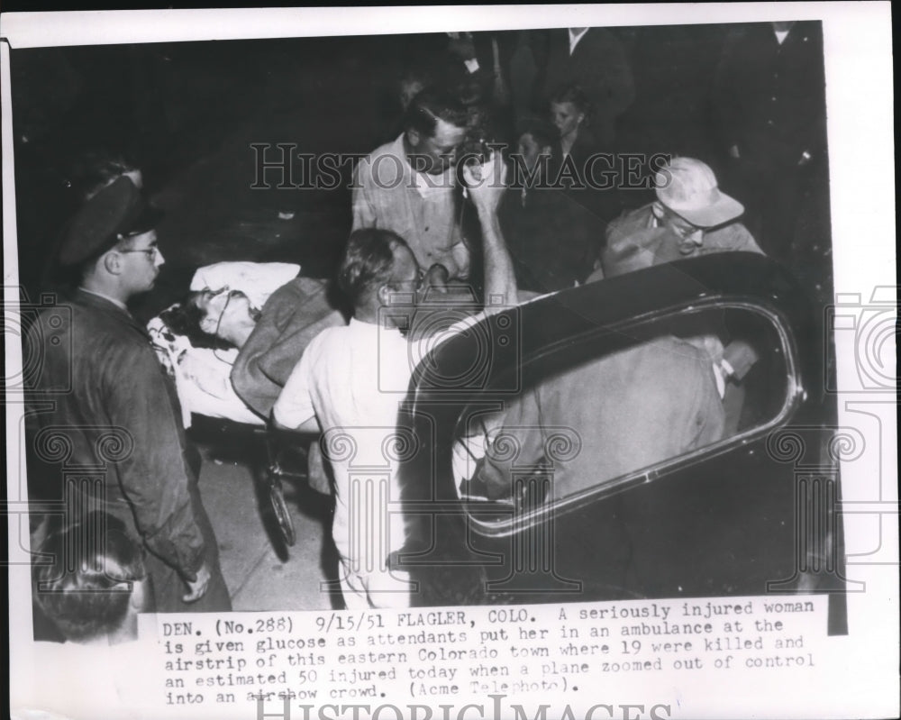 1951 Press Photo Woman Attended to After Injured at Colorado Air Show