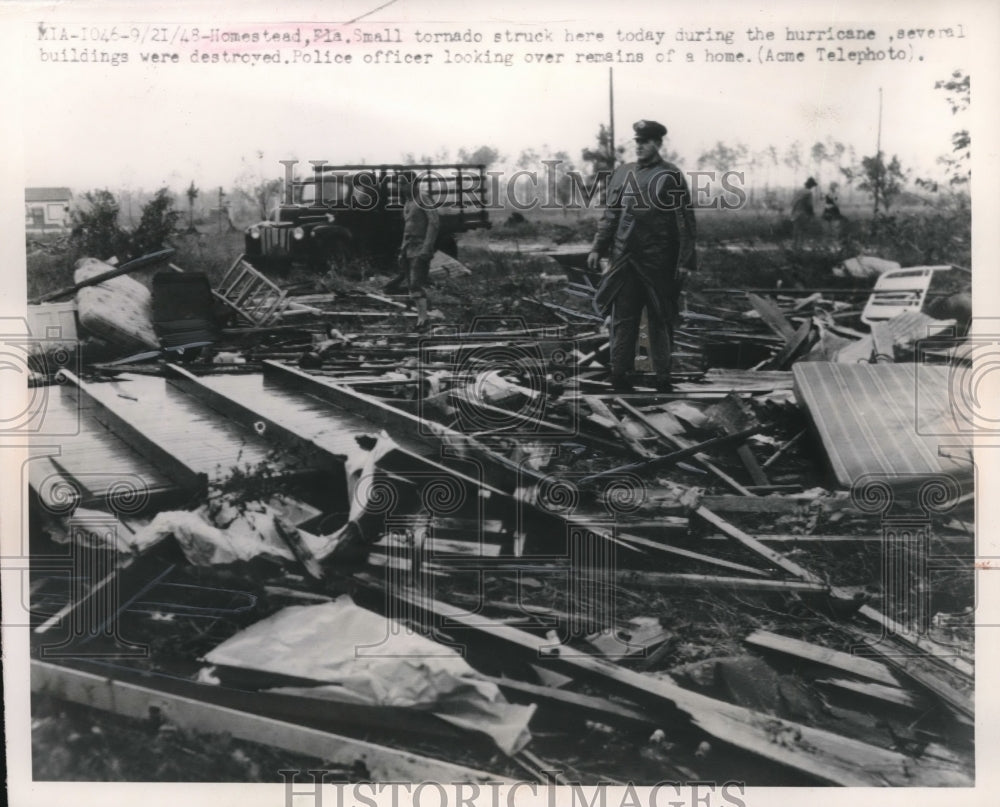 1948 Press Photo Homestead, Fla cop in devastation of tornado strike - nec72421