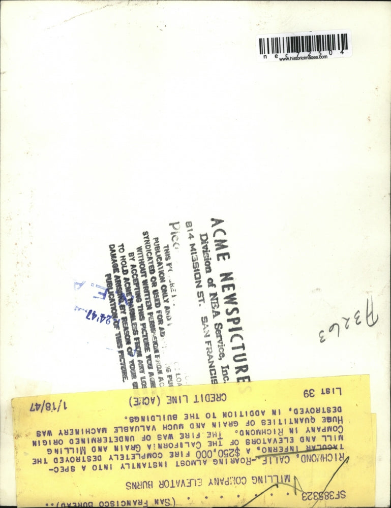 1947 Press Photo Richmond, Calif Grain & Mill Co burning as firemen battle it