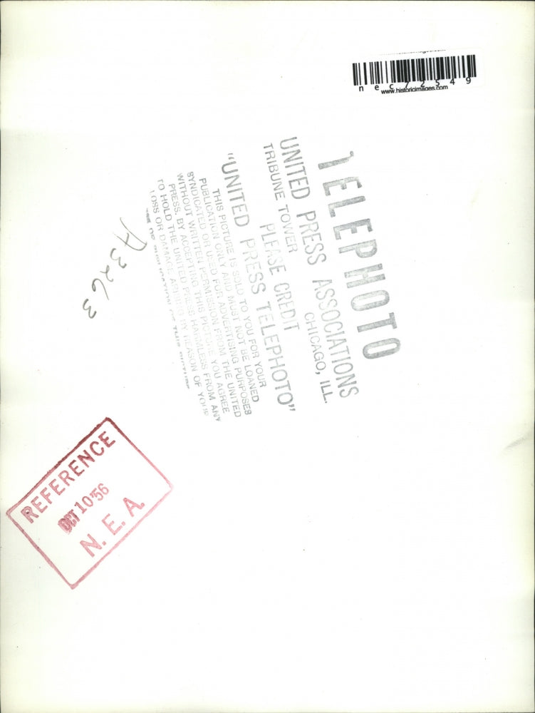 1956 Press Photo Riverside, Calif man walking in rain when forecast was sunny