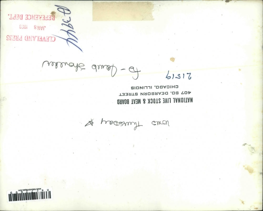 1958 Press Photo A woman prepares a lamb shoulder for cooking