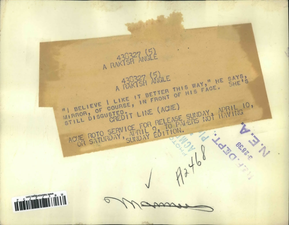 1938 Press Photo Man & woman & dinner table, wearing his hat at a rakish angle