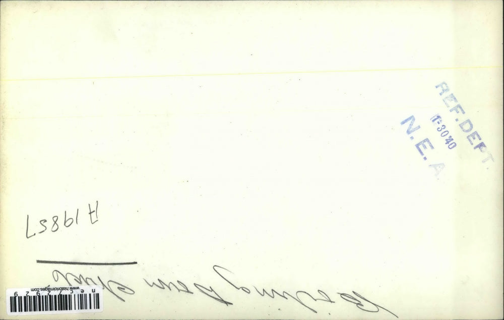 1940 Press Photo Two Men Shown Bringing Large Pot to Boil Over Fire