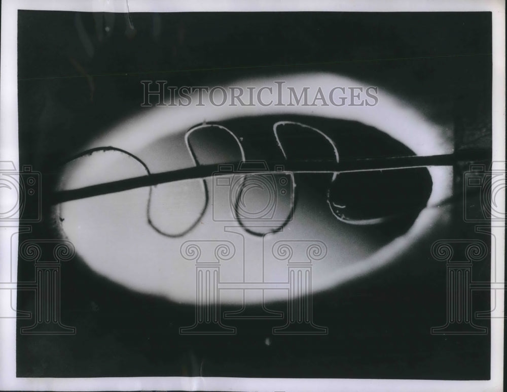 1955 Press Photo Wire Strand Threaded Through Human Hair at General Electric Lab
