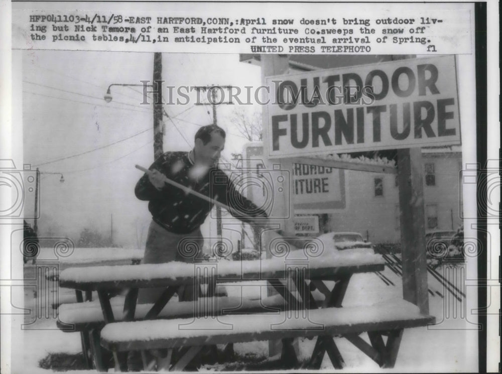 1958 Press Photo E Hartford, Conn Nick Tamore at his furniture Co in the snow