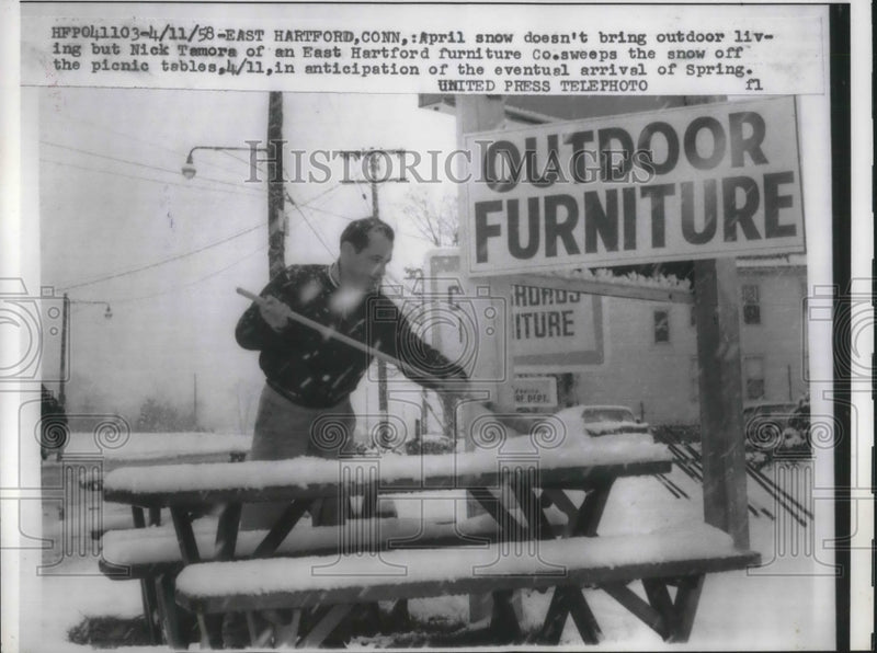 Load image into Gallery viewer, 1958 Press Photo E Hartford, Conn Nick Tamore at his furniture Co in the snow
