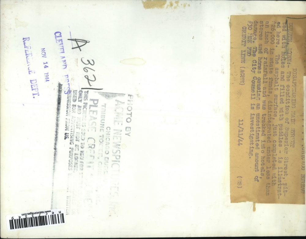 1944 Press Photo Duluth, Minn Superior St filled with potholes to be repaired