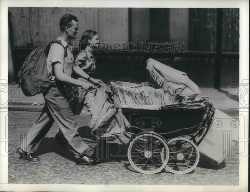 Load image into Gallery viewer, 1941 Press Photo London Couple on Vacation with Buggy and Backpacks

