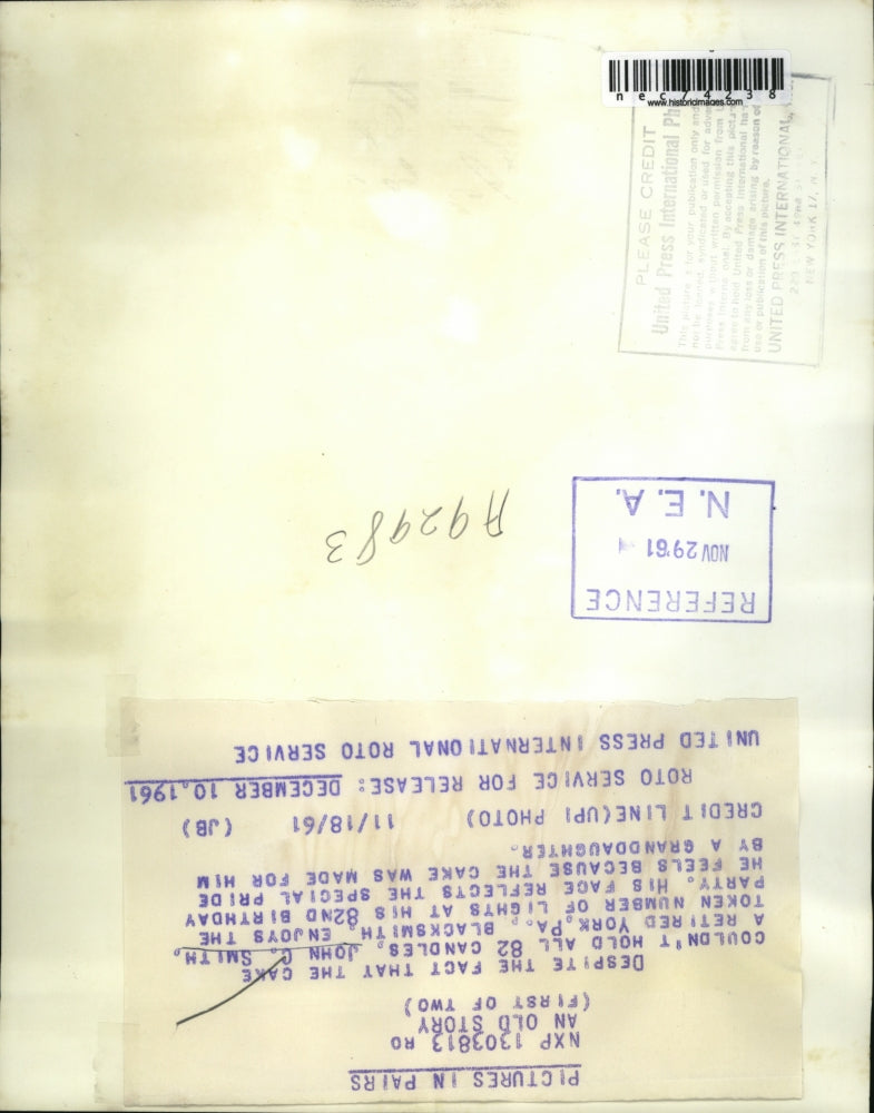 1961 Press Photo John C Smith at 82nd birthday with his cake