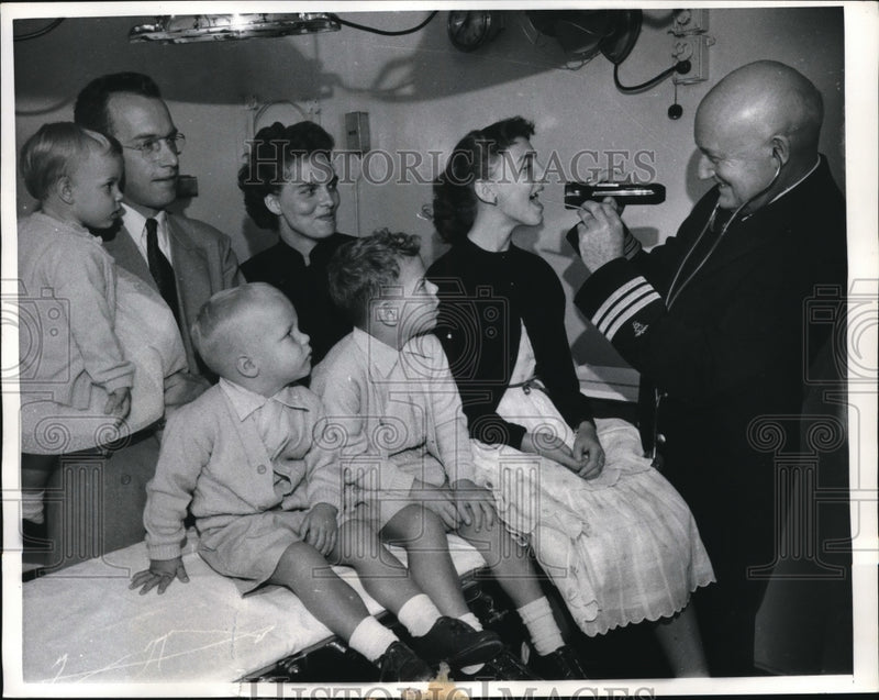 Load image into Gallery viewer, 1957 Press Photo Dr Francis Galbraith &amp; Reynolds family on liner Pres Cleveland
