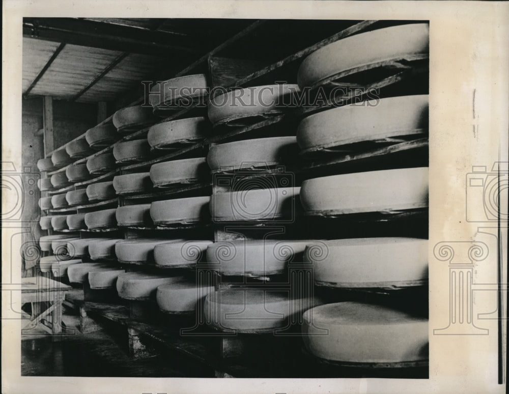 1939 Press Photo Swiss cheese manufactured and on aging shelves- Historic Images