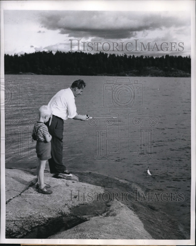 Load image into Gallery viewer, 1959 Press Photo Lars Erik &amp; Mr Wisteck fishing at a lakeside
