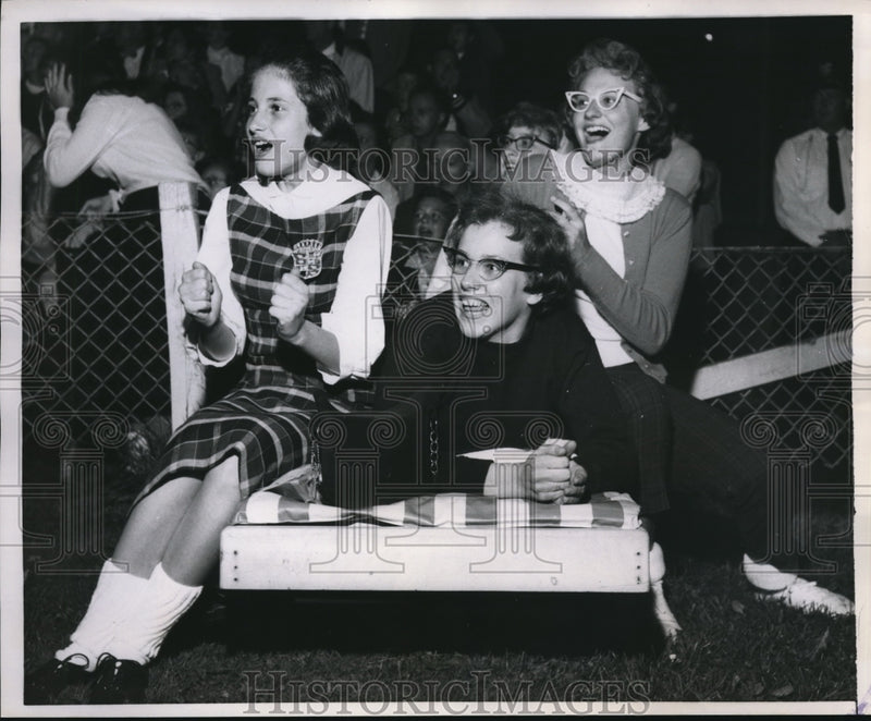 Load image into Gallery viewer, 1958 Press Photo Jane Schweitzer &amp; Friends Attend Football Game in Niles, OH
