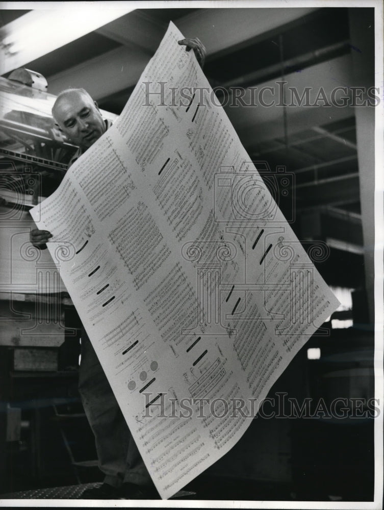 1960 Press Photo pressman Arthur Tosques checks music sheet fresh off the press