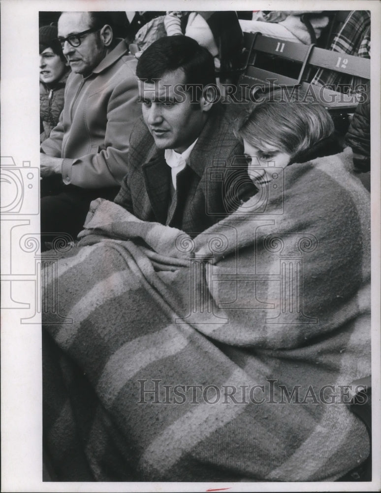 Load image into Gallery viewer, 1970 Press Photo Joe Pishotti and Donna Fedarki snuggled up in the bleachers
