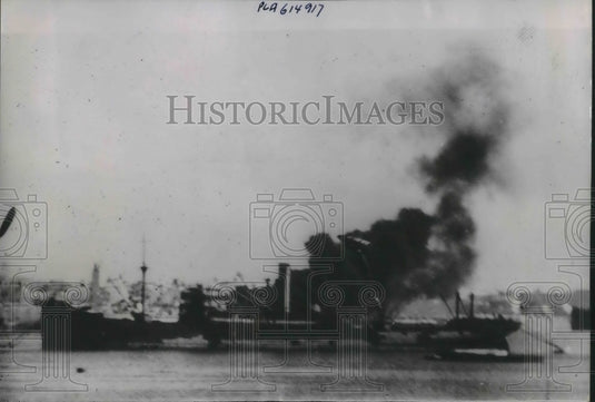 1941 Press Photo Italian Firefighter hit by RAF Tripoli - nec76089