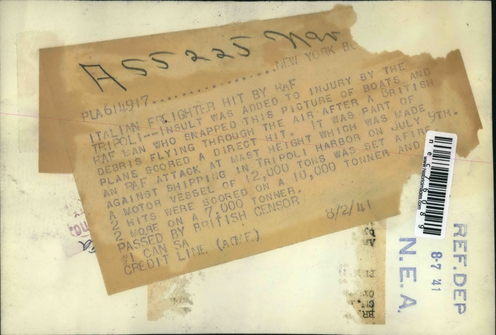 1941 Press Photo Italian Firefighter hit by RAF Tripoli - nec76089