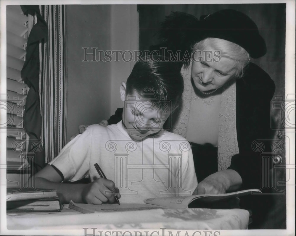 1950 Press Photo Mrs. E.J. Grant helping adopted son