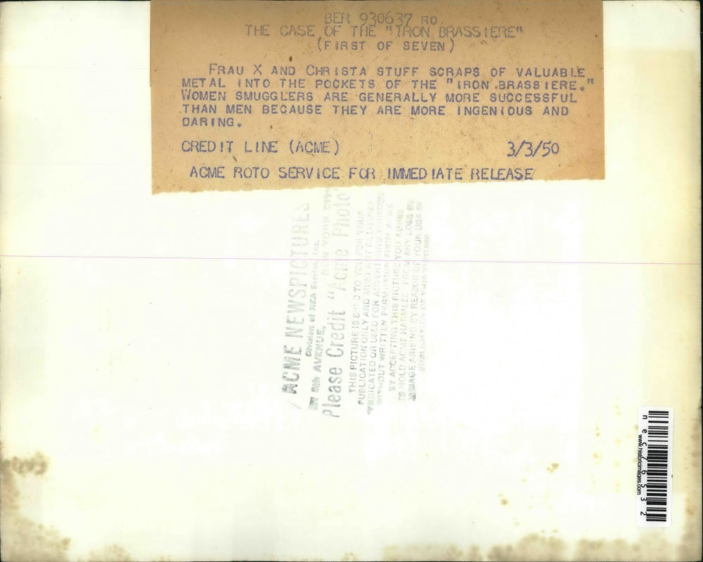 1950 Press Photo Frau & Christa stuff scraps of valuable metal to Iron Brassier