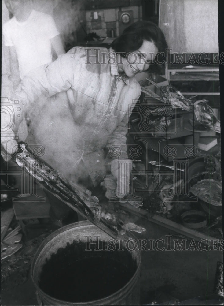 1966 Press Photo Lady deals in metal sculpture