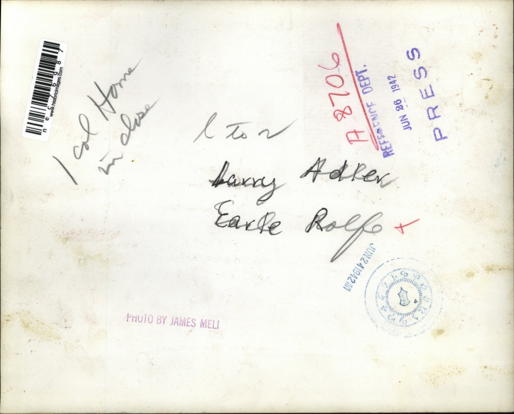 1942 Press Photo American musician Larry Adler conferring with Earle Rolfe