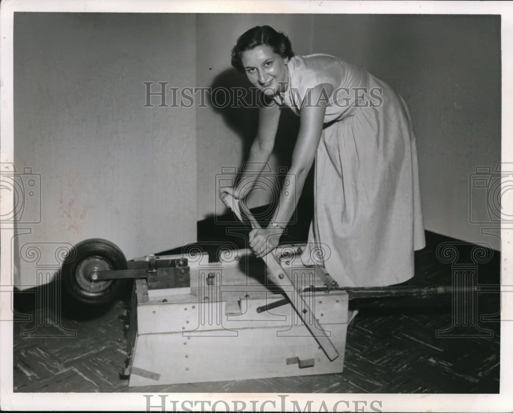 1954 Press Photo Lady demonstrating the self made wheel borrow