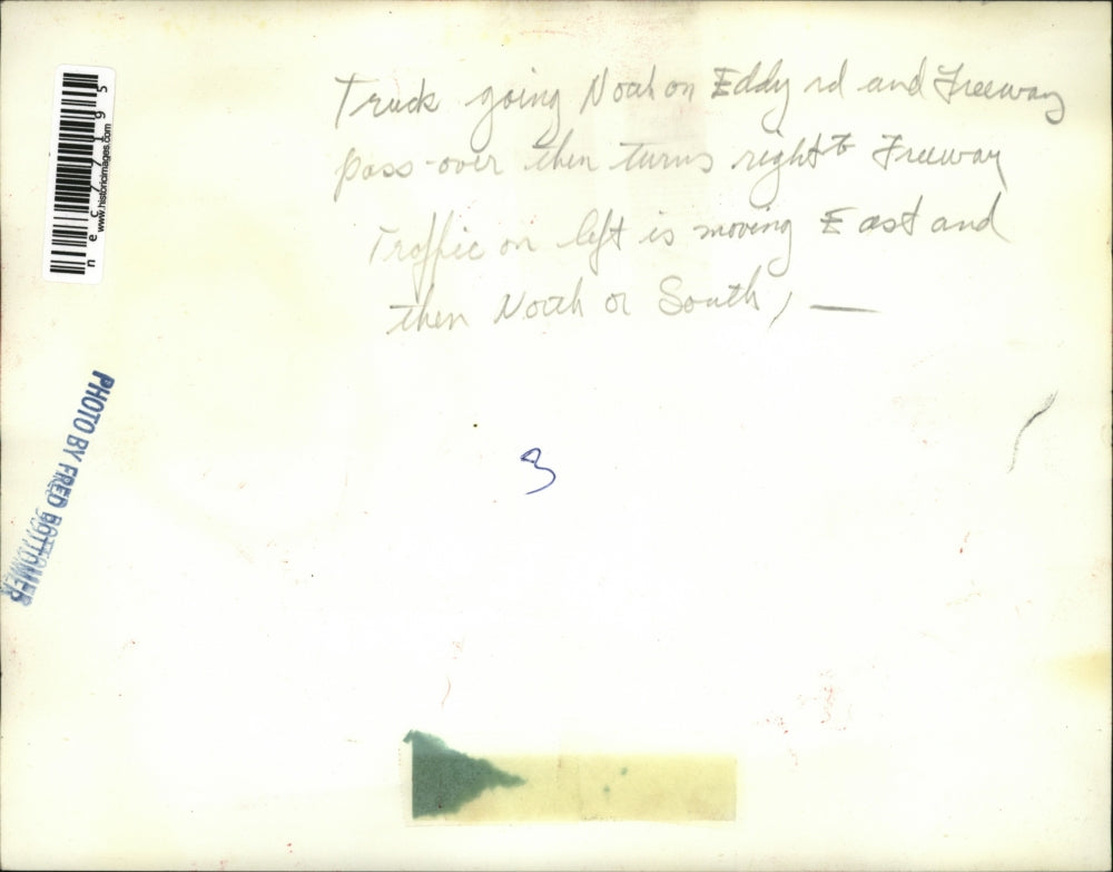 Press Photo Truck going Noah on Eddy rd. & Freeway pass-over then turns right