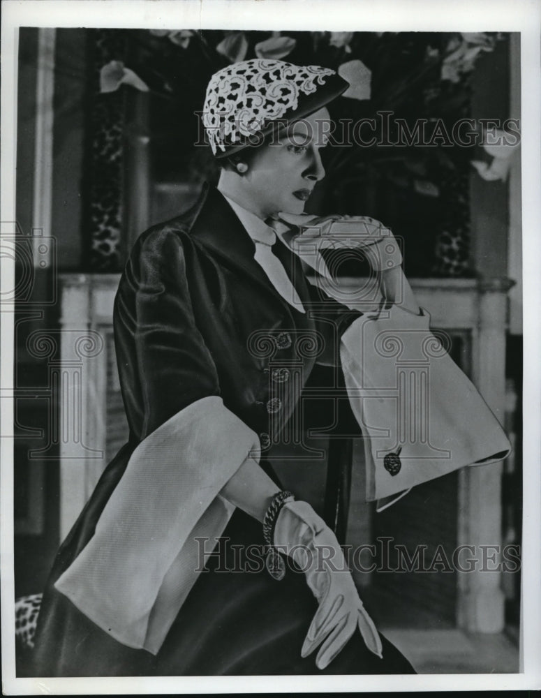 1950 Press Photo A lady wearing a lace adorned hat and velvet jacket