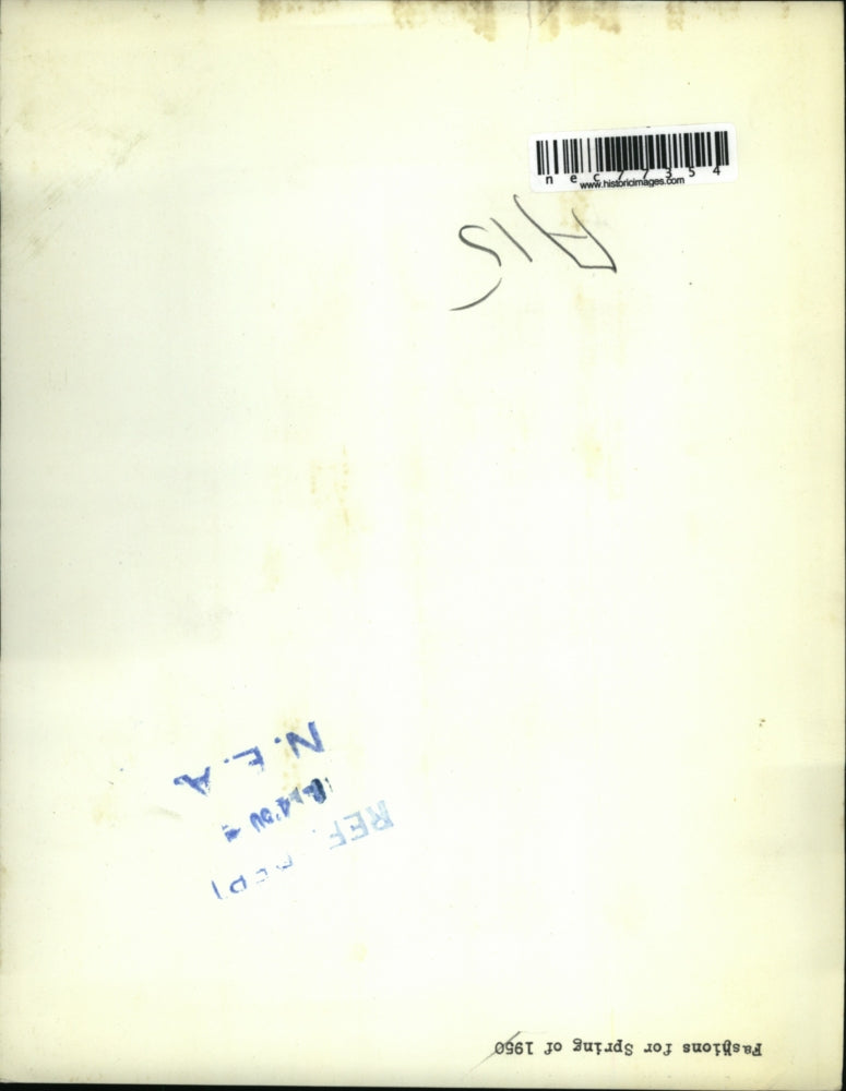 1950 Press Photo A lady wearing a lace adorned hat and velvet jacket