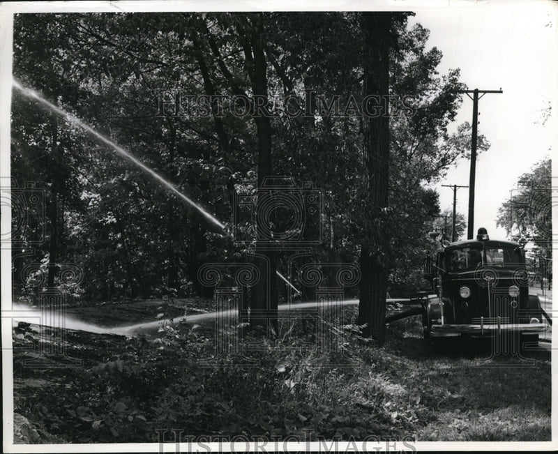 Load image into Gallery viewer, 1962 Press Photo False Falls at Mt. Pleasent, Michigan, Fire Truck
