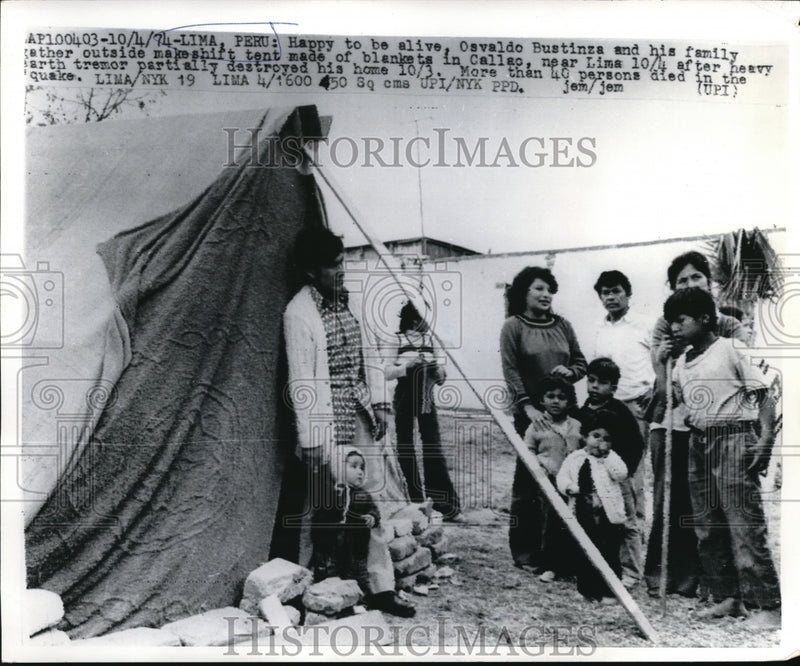 Load image into Gallery viewer, 1974 Press Photo Osvaldo and Family outside makeshift tent in Callao near Lima.
