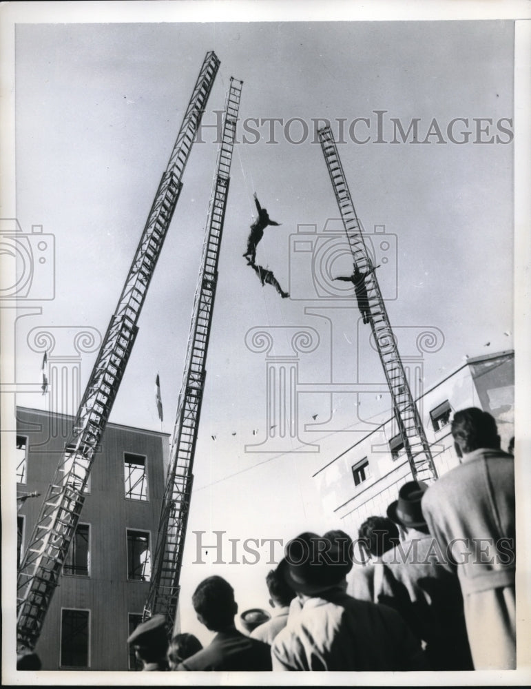 Load image into Gallery viewer, 1957 Press Photo Roman Firemen at their ladders during Saint Barbara Day
