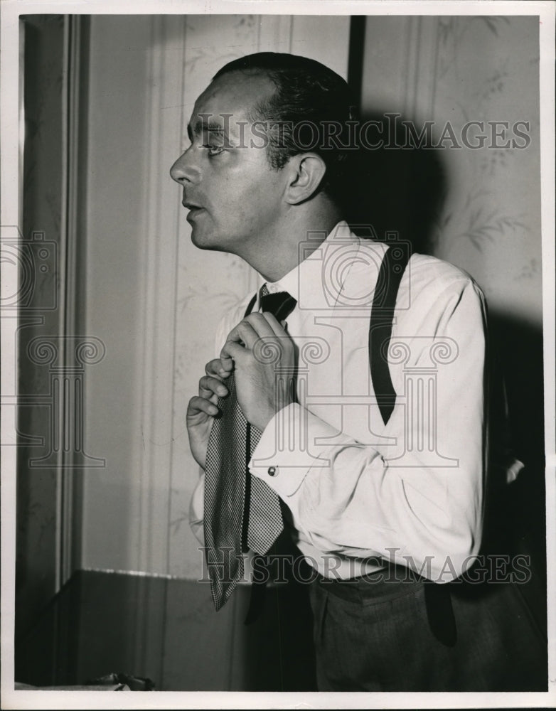 1949 Press Photo Adler Adjusts his tie