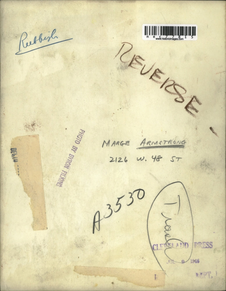 1946 Press Photo Marge Armstrong ealing with trash pile getting out of control