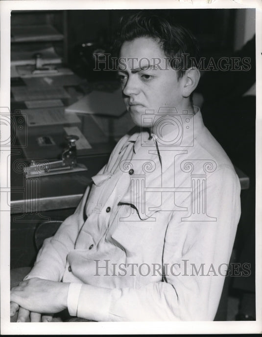 1953 Press Photo Peter K Abor being booked in Cleveland Ohio