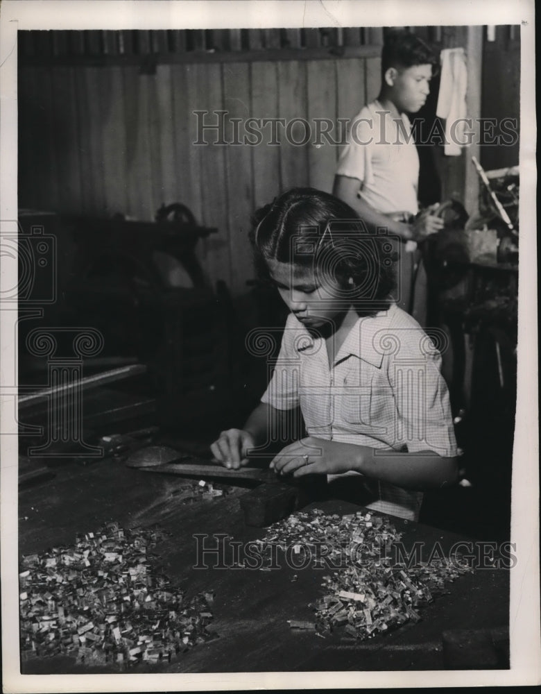 1947 Press Photo A young Siamese girl files down pieces of type for the boy to- Historic Images