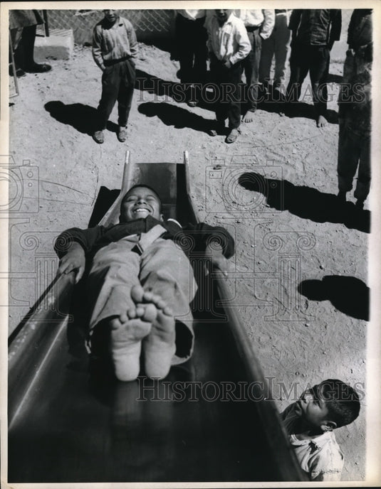 1971 Press Photo Patzun boy sliding down slide