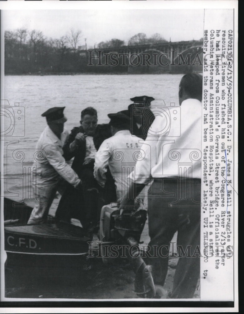 Load image into Gallery viewer, 1959 Press Photo Dr James Neill Struggles With Rescuers After Being Pulled
